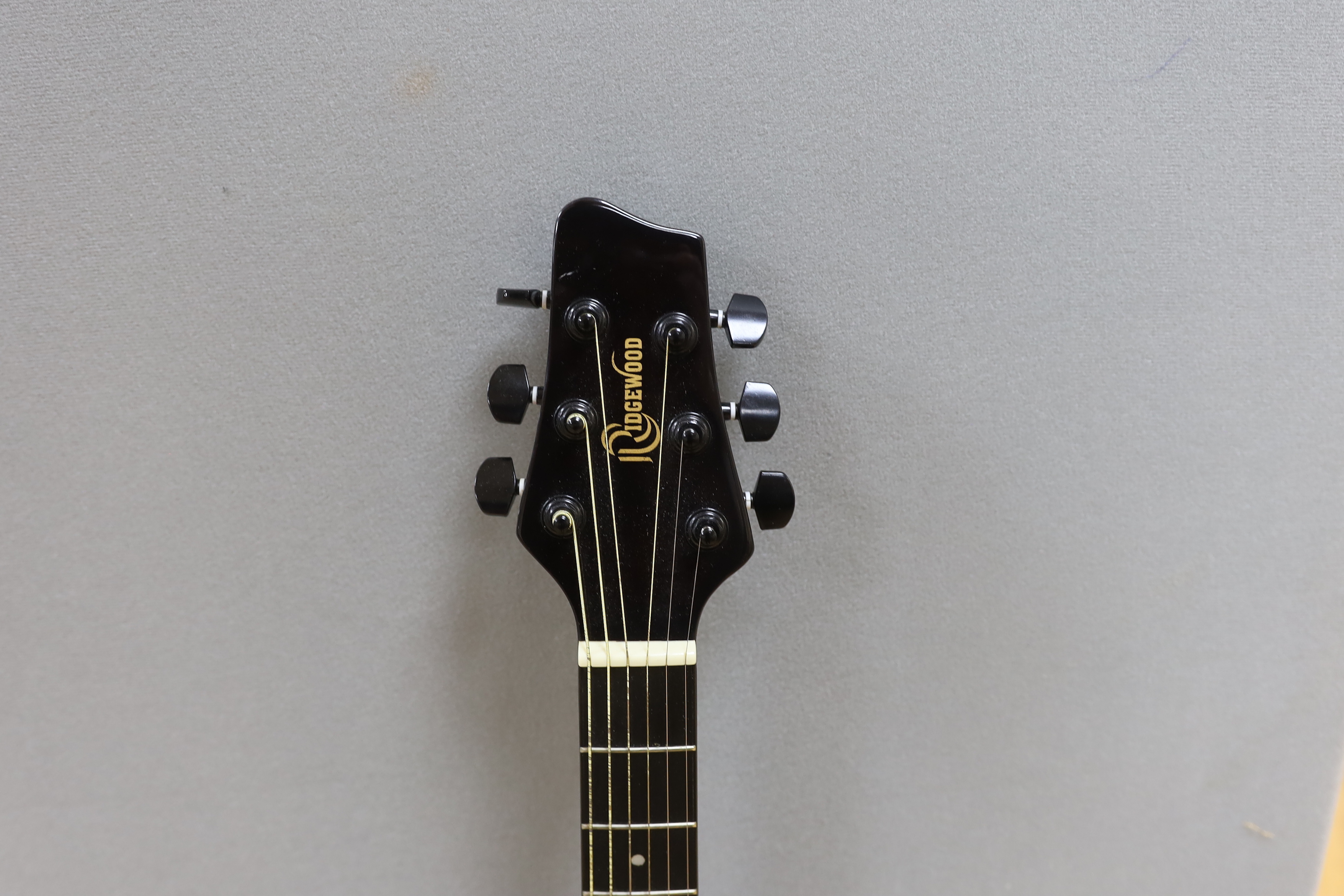 A Rockwood acoustic guitar, in a soft case